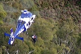 Victorian Water Minister Tim Holding is winched from  Mt Feathertop