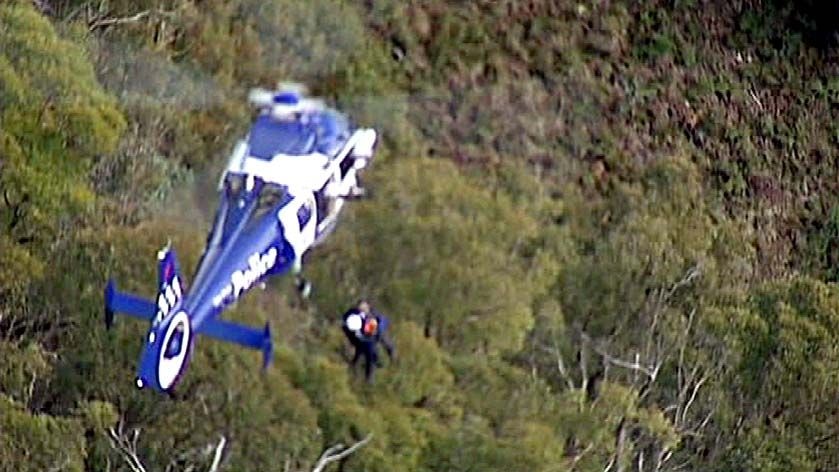 Victorian Water Minister Tim Holding is winched from  Mt Feathertop