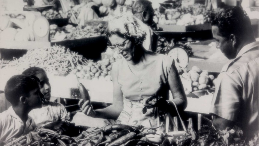 Woman shopping for fresh produce at the market located between Harris Road and Rodwell Road in Suva, Fiji.