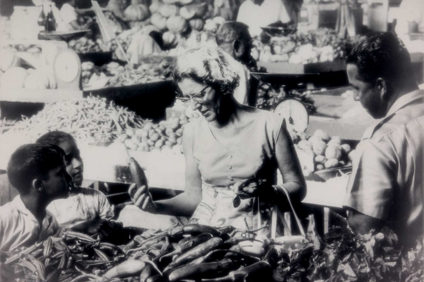 Woman shopping for fresh produce at the market located between Harris Road and Rodwell Road in Suva, Fiji.