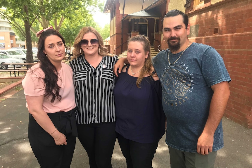 Ms Boyd's sister, Rhiannon, stands with her cousin, Hayley Hoskin-Elliott, and friends, Katherine Shields and Mason Harris