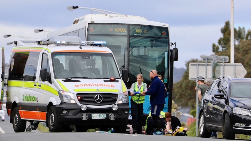 Pedestrian being attended to after being hit by school bus, Tasmania 9 November, 2018.