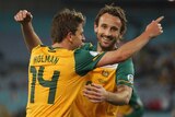 Hot form ... Josh Kennedy (R) celebrates with Brett Holman during the win over Oman (Mark Kolbe: Getty Images)