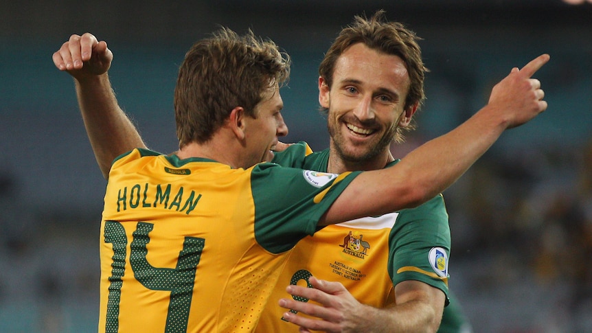 Hot form ... Josh Kennedy (R) celebrates with Brett Holman during the win over Oman (Mark Kolbe: Getty Images)