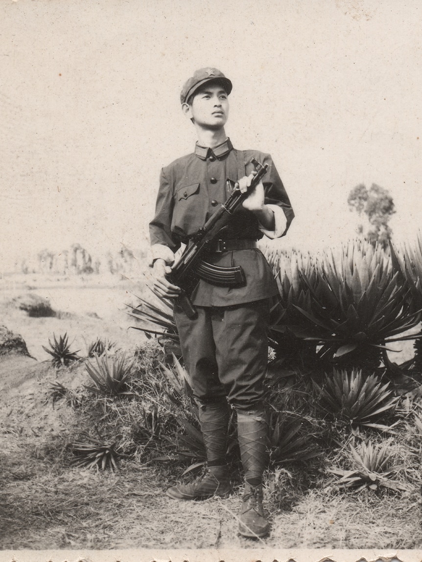 A file photo of a young Chinese PLA soldier holding a gun in 1979.