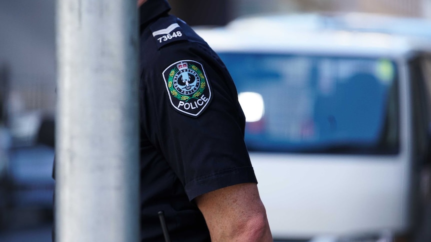 An SA Police logo on the shoulder of a police officer's uniform.