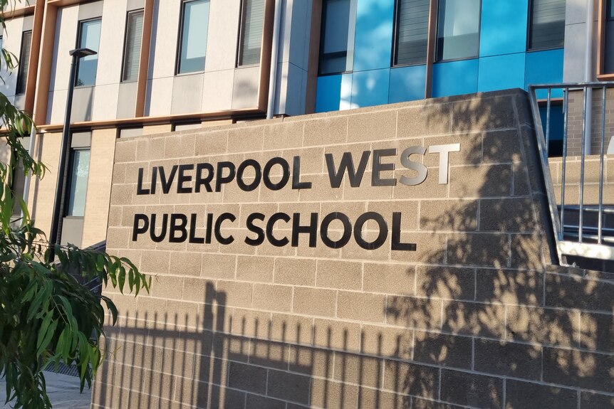 Front sign of Liverpool West Public School on brick