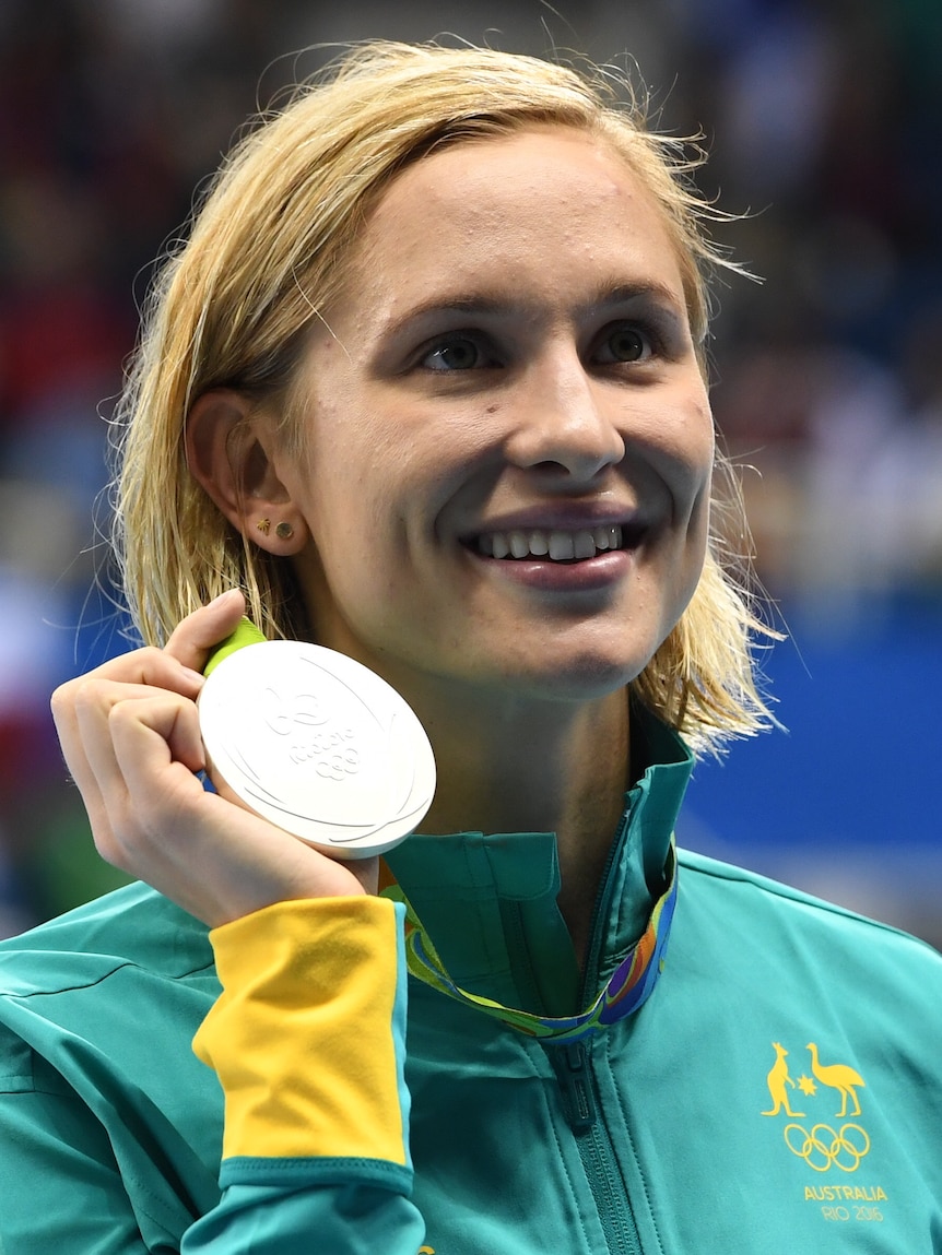 Australian swimmer Maddie Groves holds up her silver medal at the 2016 Rio Olympic Games after the 200 metres butterfly final.