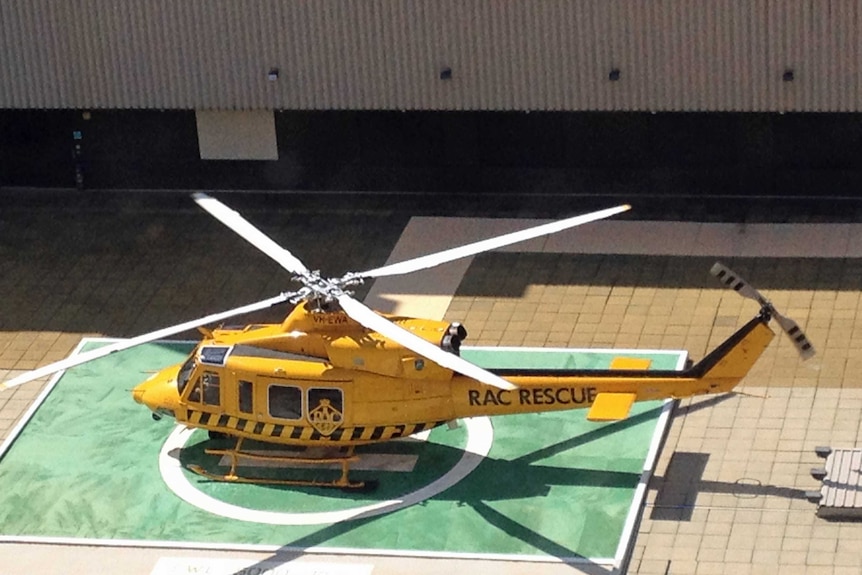 The yellow RAC rescue helicopter arrives are Royal Perth Hospital.