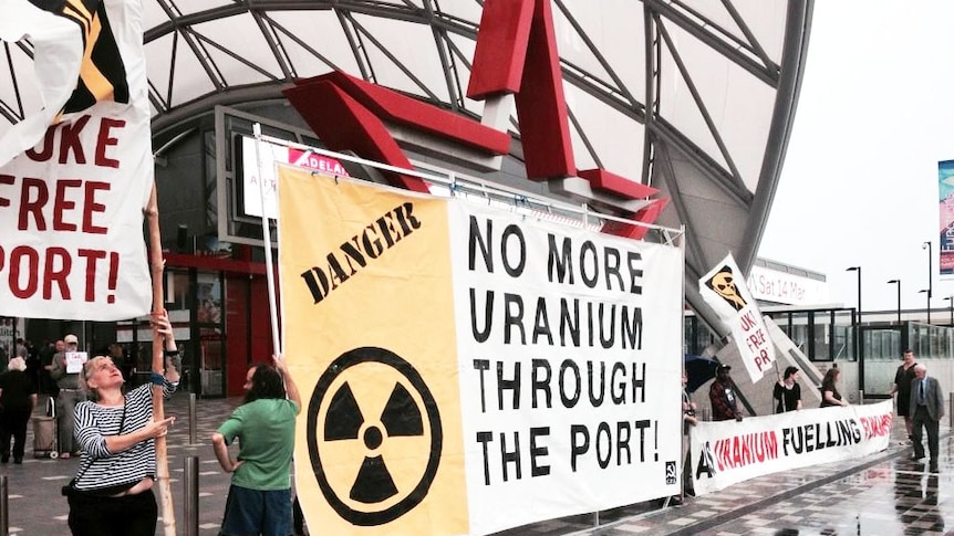 Protesters erect anti-uranium signs outside the BHP Billiton annual general meeting in Adelaide.