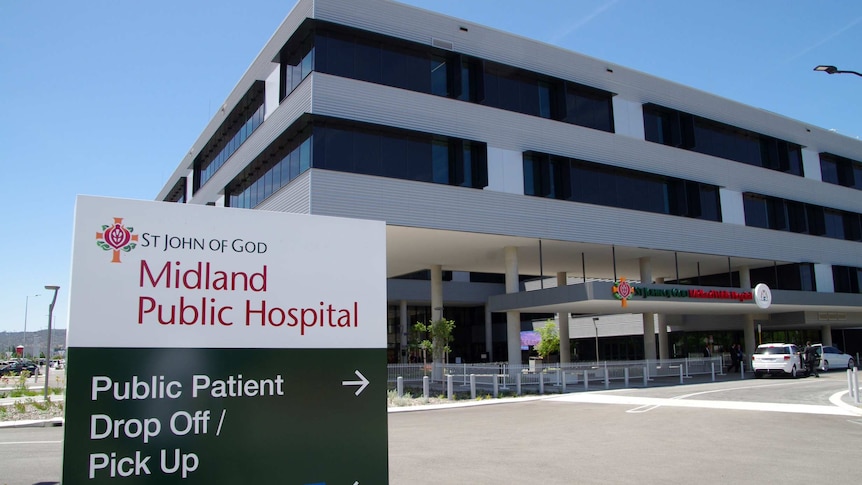 Entrance to Midland Public Hospital, including sign in foreground