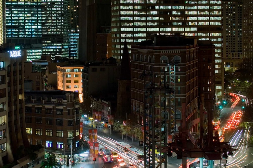 A time-lapse image of traffic driving through Sydney at night.