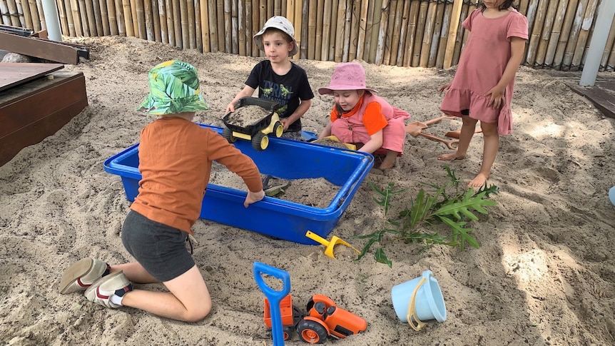 Children playing in a sandpit. 
