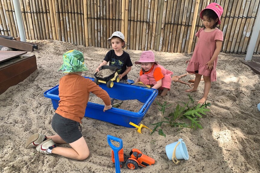 Children playing in a sandpit. 