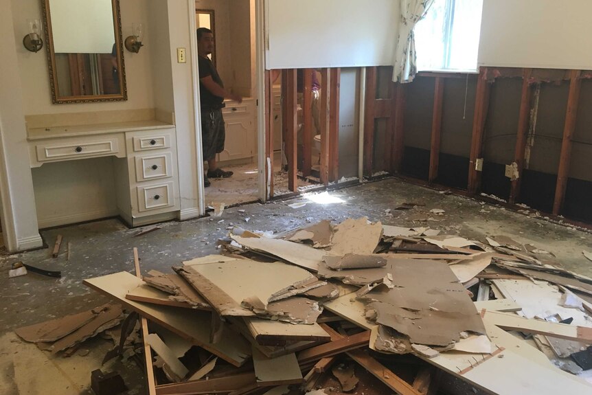 The inside of Jane Middlebrooks' house littered with flooded building debris.