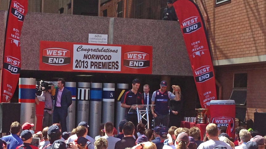 Norwood coach Nathan Bassett and captain Kieran McGuinness celebrate with supporters at the brewery.