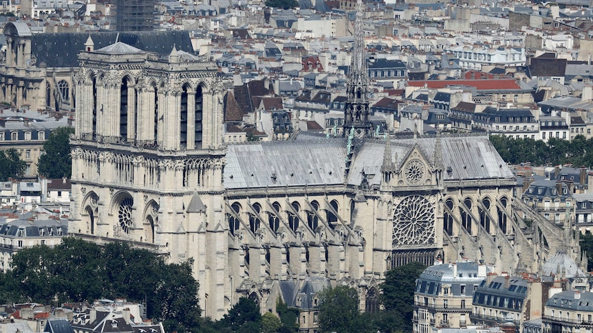 A distant view of the Notre Dame Catheral in Paris, its spire still in tact
