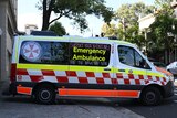 an ambulance with messages written on the side reading australias lowest paid paramedics