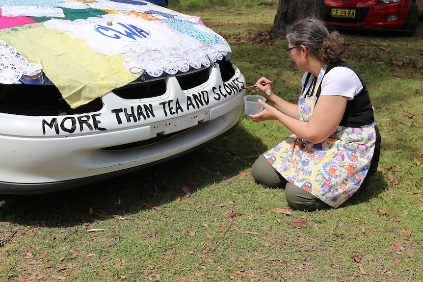 Woman paints 'more than tea and scones' on car