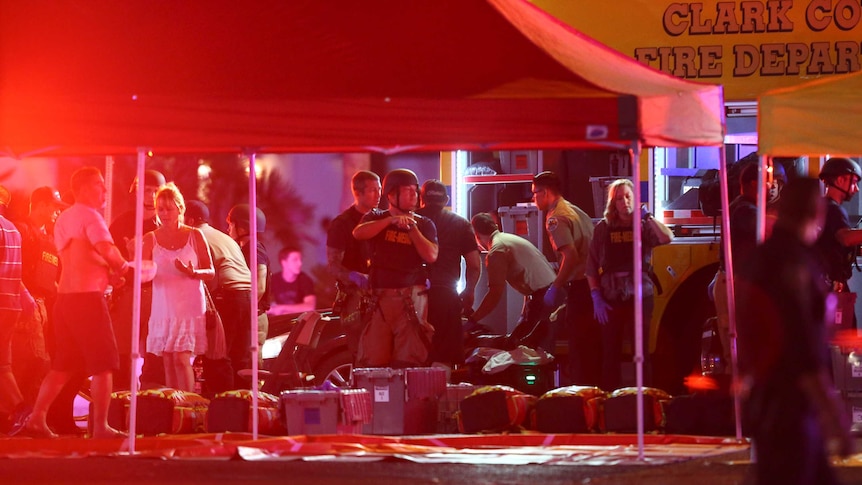 Injured people are treated under tents set up by the Las Vegas Fire Department