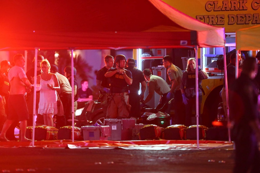 Injured people are treated under tents set up by the Las Vegas Fire Department