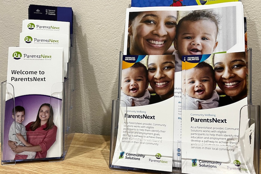 Two small stands displaying information flyers for parenting.