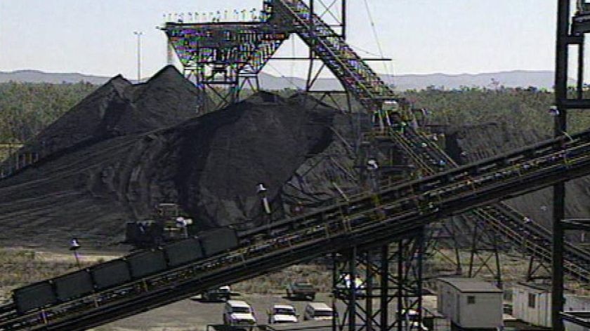 Coal mining site with conveyor belts and excavator equipment at an unidentified location in central-