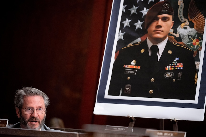 A framed phptp of a man dressed in uniform wearing medial is on display. 