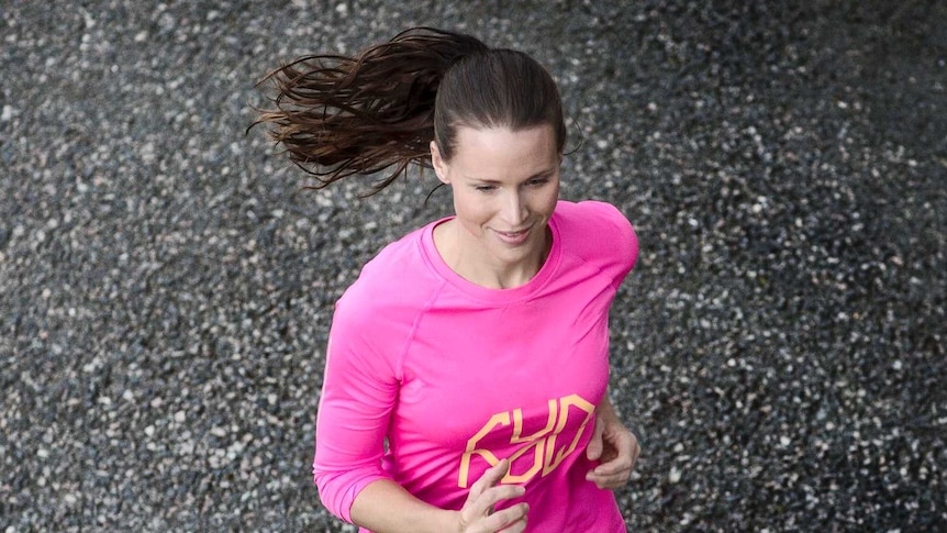 Ponytail swings as a woman jogs