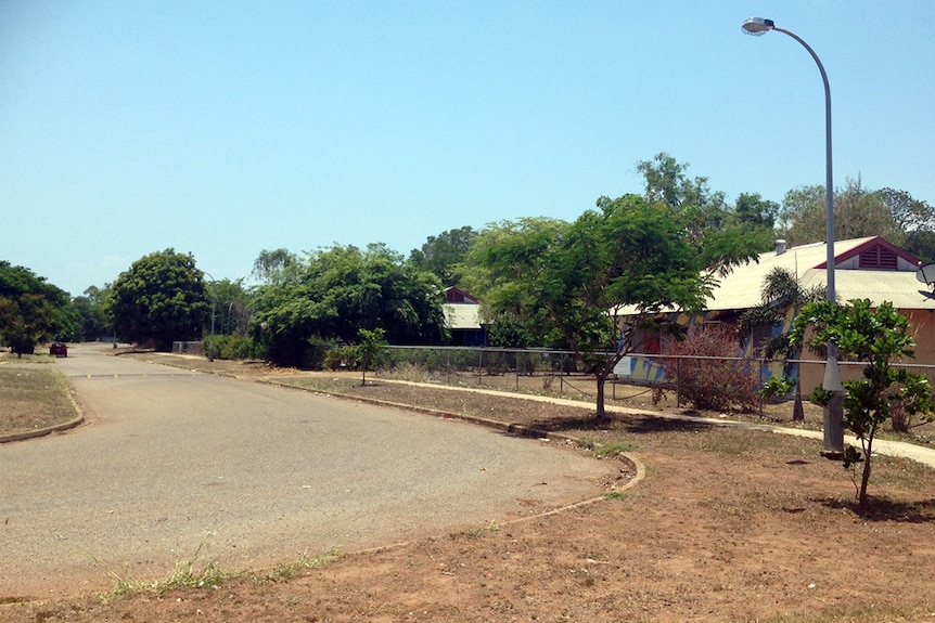 Houses line a quiet street.