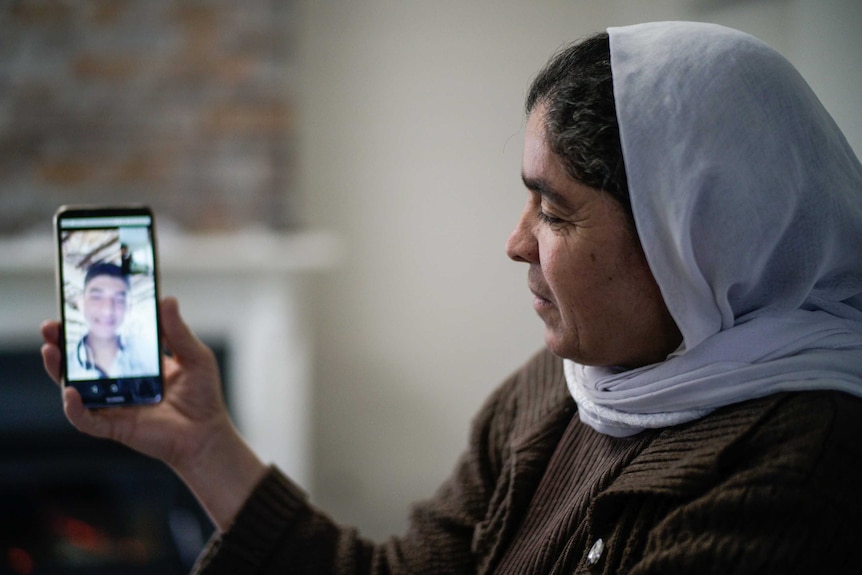 A woman talks on the phone.