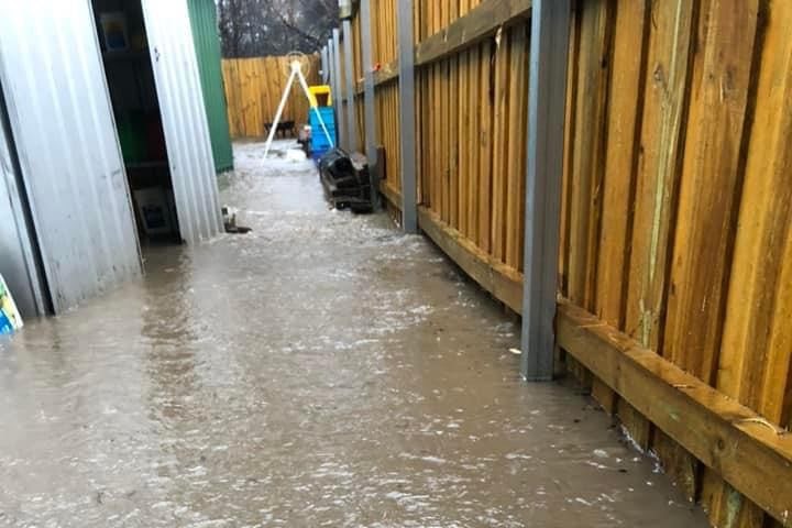 Flooding in the backyard of a rural property.