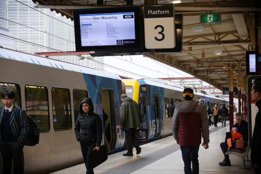 A few passengers board a Glen-Waverley bound train at Flinders Street Station