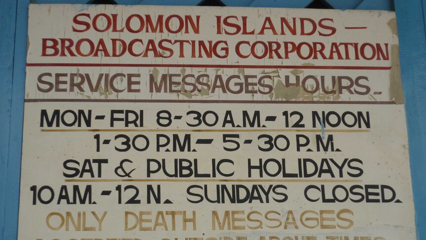 Solomon Islands Broadcasting Corporation sign that reads "SERVICE MESSAGE HOURS, ONLY DEATH MESSAGE ACCEPTED OUTSIDE ABOVE TIMES