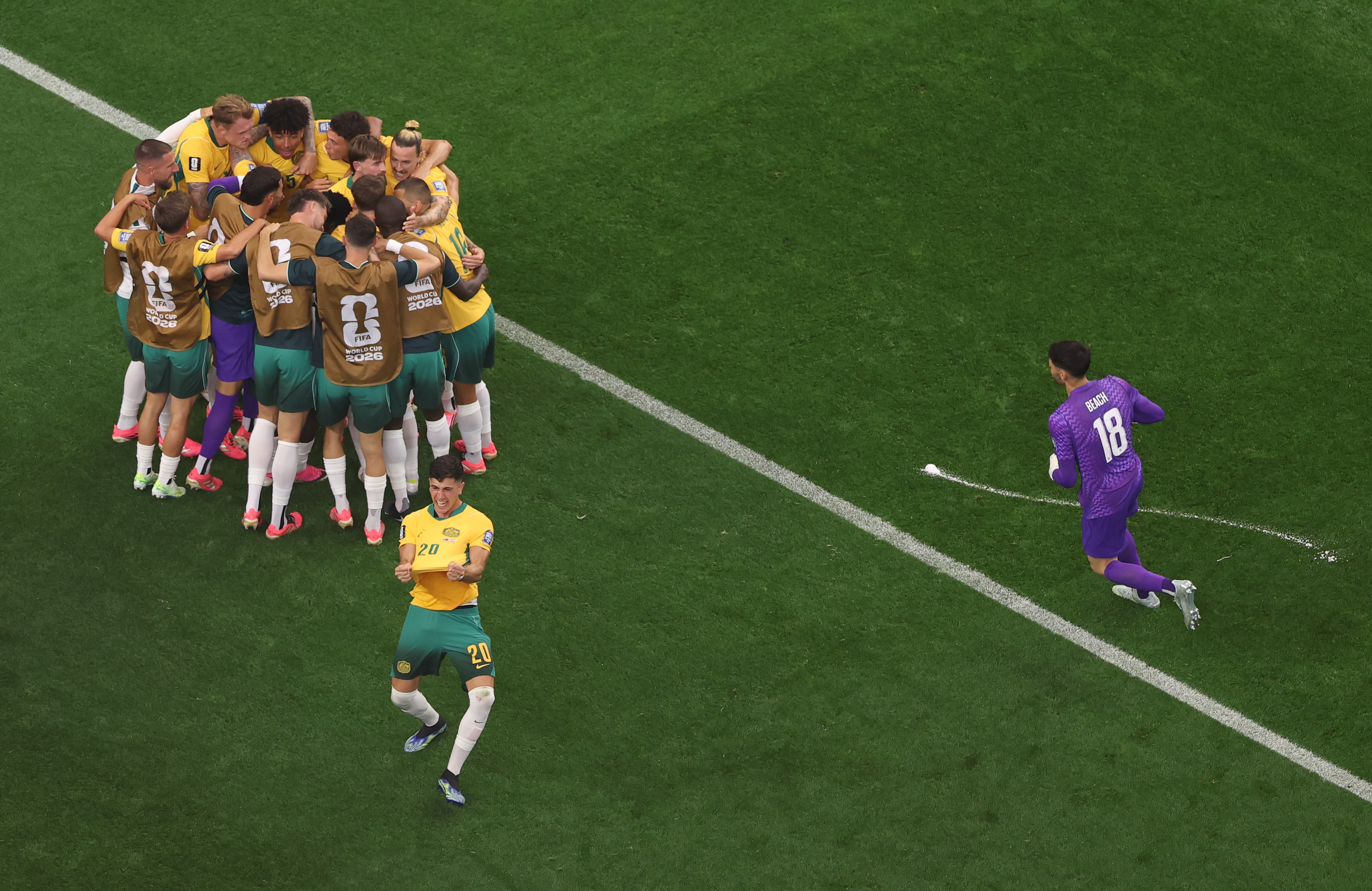 The Socceroos celebrate the equaliser.