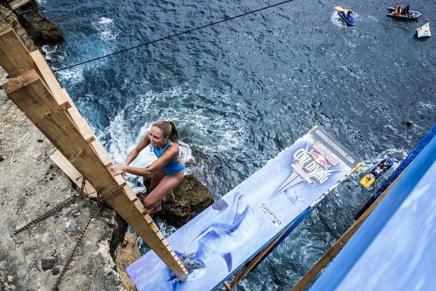 Helena Merten climbs down to a 20.5-metre diving platform in Sao Miguel in Portugal.