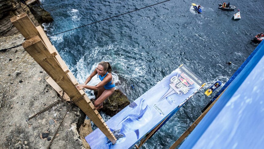Helena Merten climbs down to a 20.5-metre diving platform in Sao Miguel in Portugal.