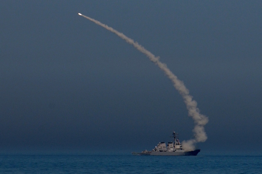 A missile being fired from a US naval ship in the Arabian Gulf
