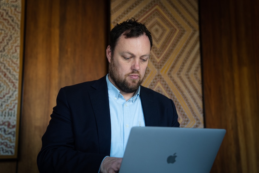 Brendan Coates in an office working