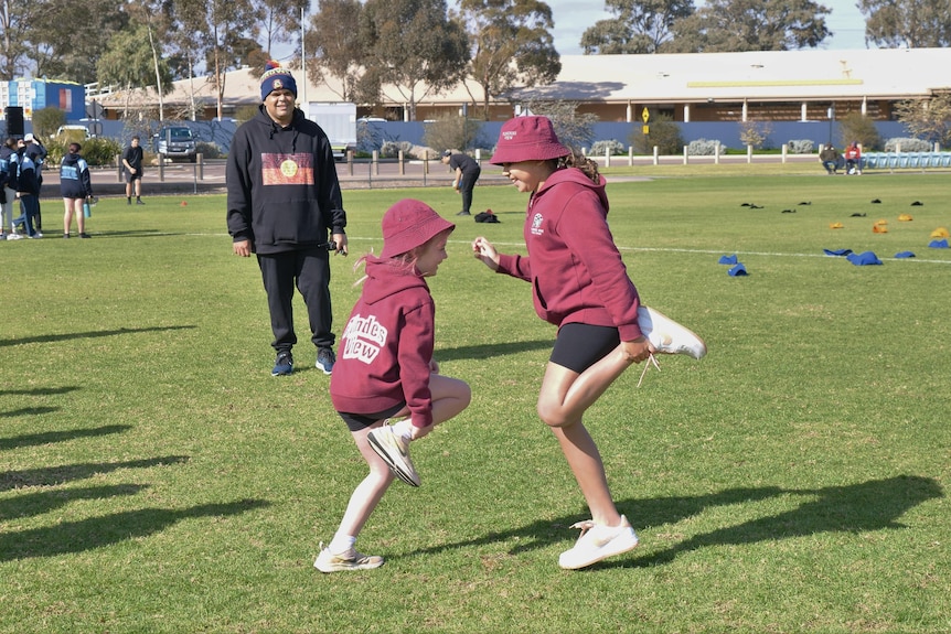 Port Augusta language teacher Kahran McKenzie with school students on Youth Day at 2022 NAIDOC Week.