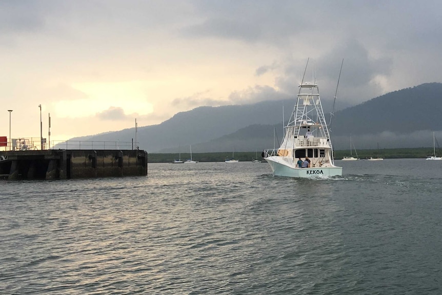 A 56-foot game fishing boat leaves the marina in Cairns