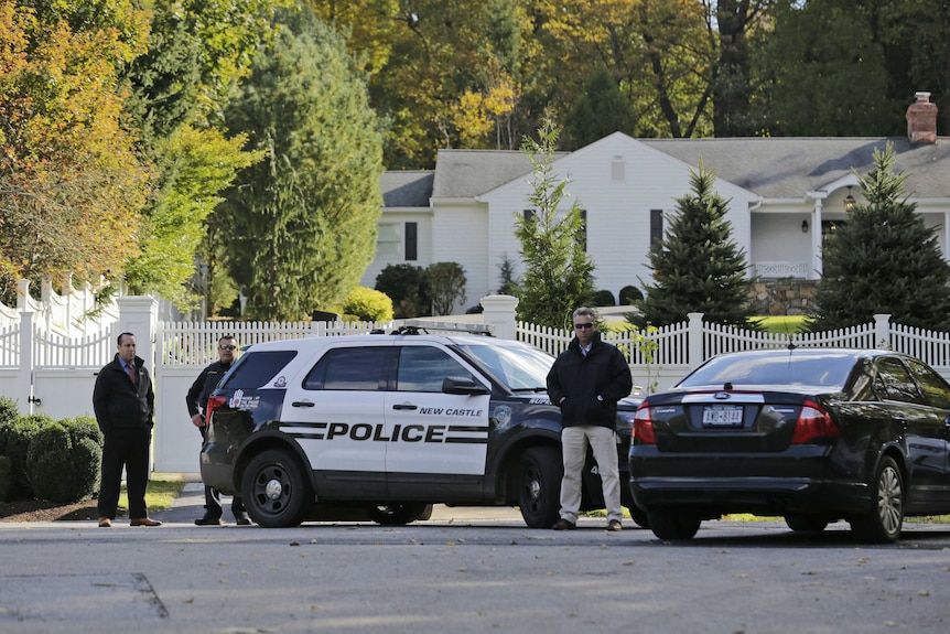 Police outside the New York home of Bill and Hillary Clinton