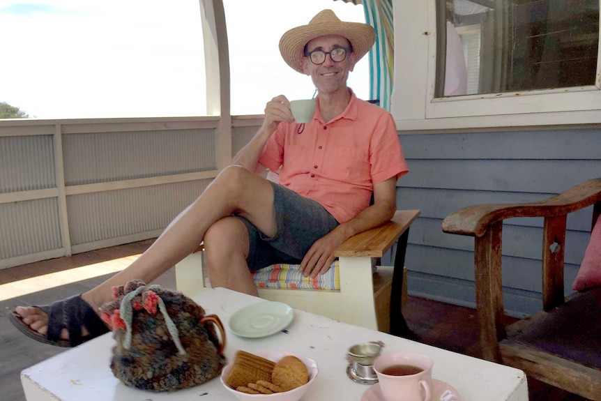 Neil Goodridge sits on his deck in the Mornington Peninsula.