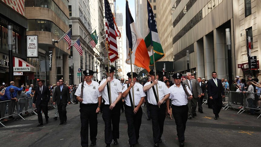 Police officers march to mark the 15th anniversary of the September 11 attacks