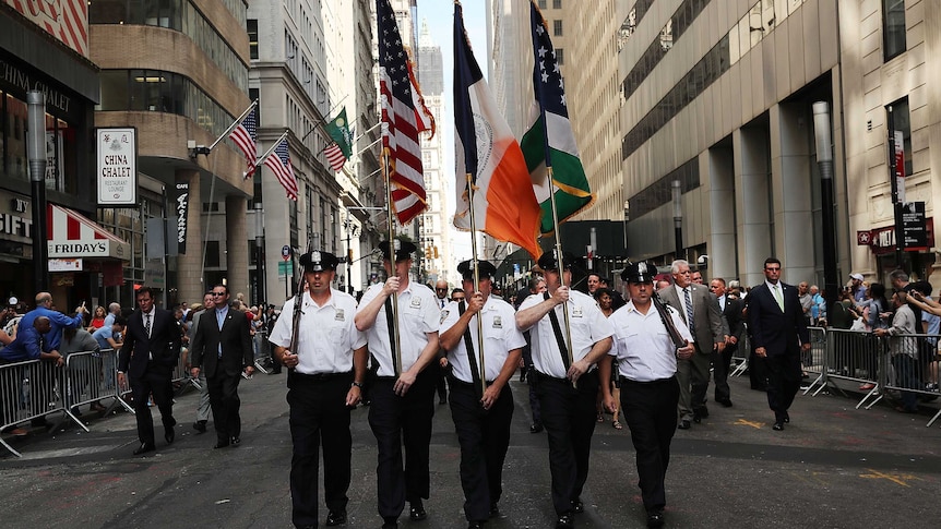 Police officers march to mark the 15th anniversary of the September 11 attacks