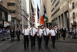 Police officers march to mark the 15th anniversary of the September 11 attacks