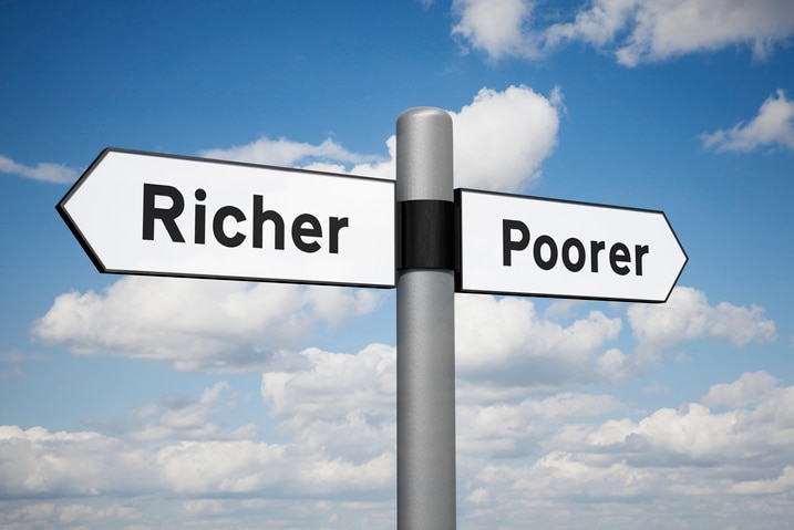 Image of a sign post with arrows labelled 'Richer' and 'Poorer'