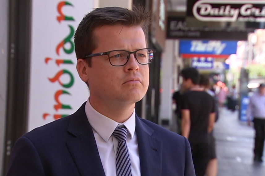 A man wearing a suit and tie