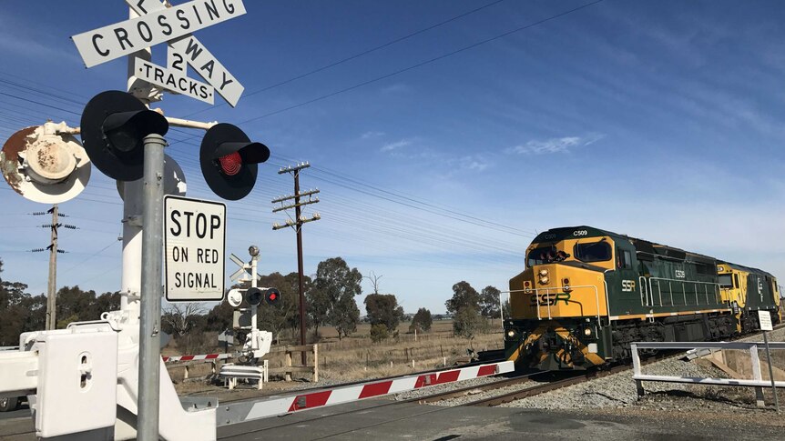 Kevin Schulz drives through a level crossing.