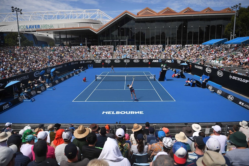 A high shot of an outdoor court as two players play a match at the Australian Open